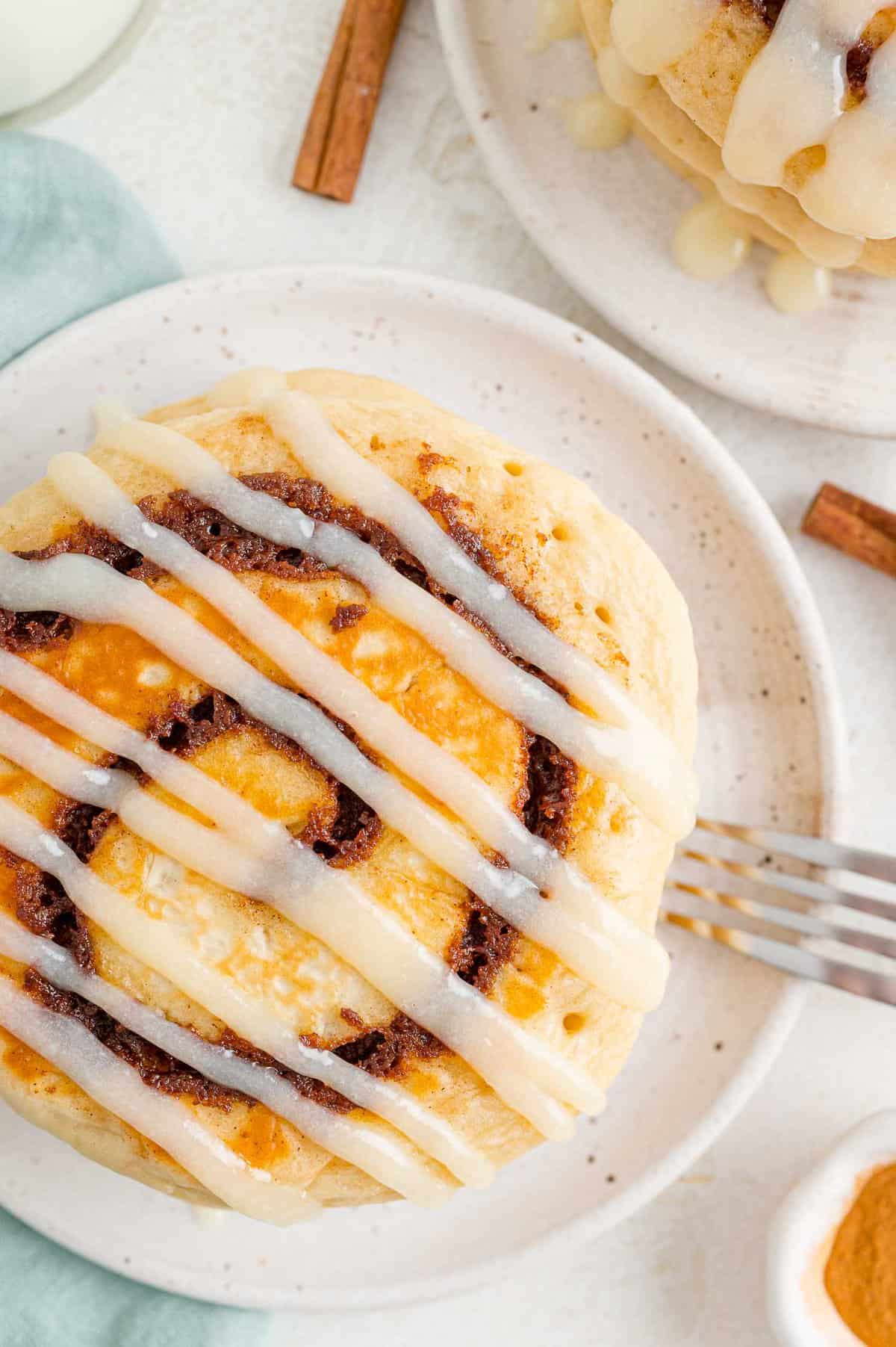 Cinnamon roll pancake with glaze.