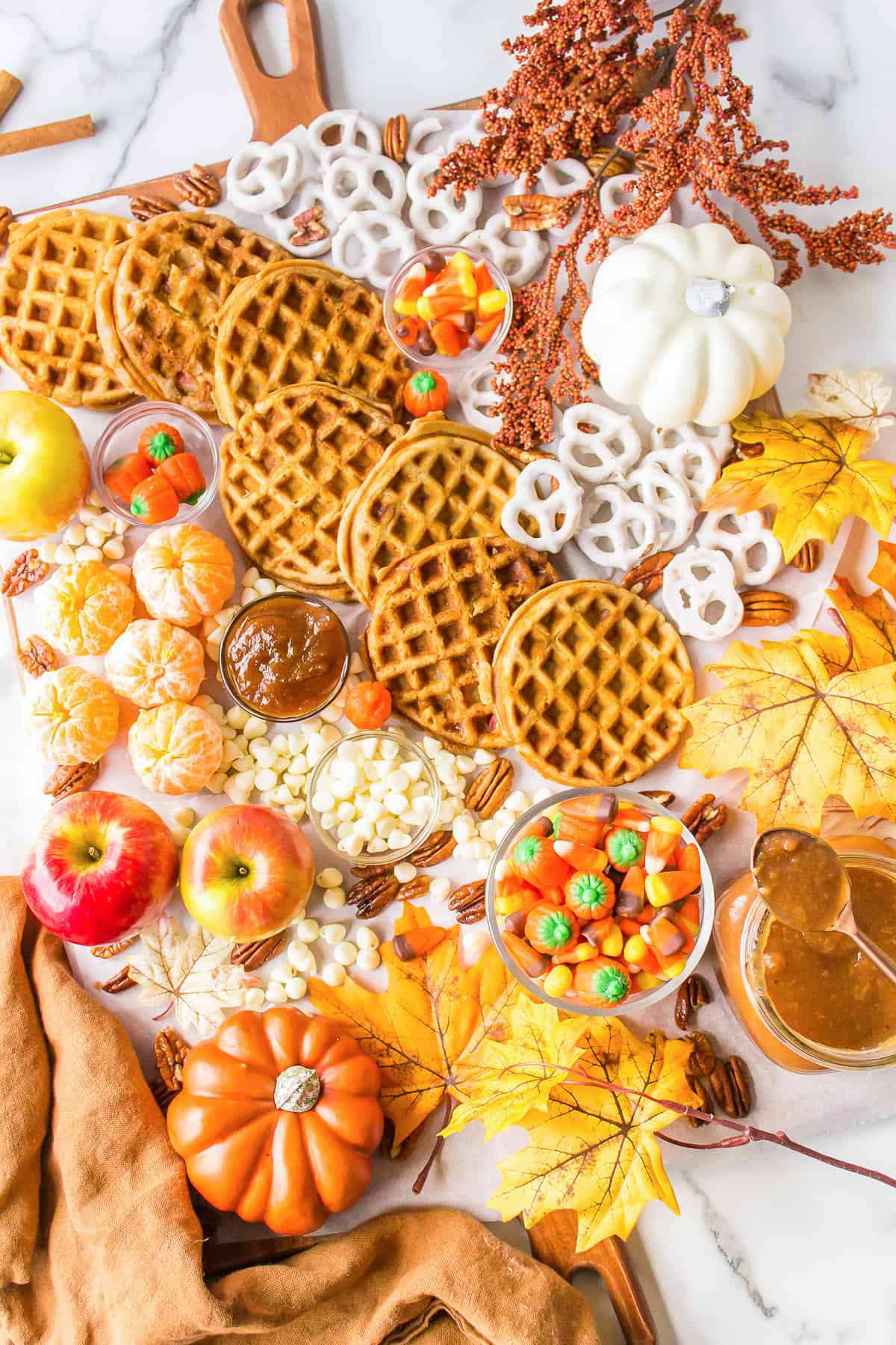 Waffles and other treats on a brunch board.
