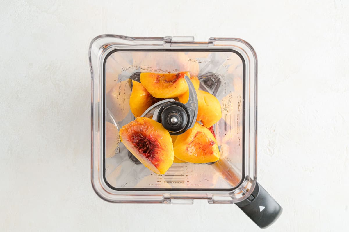 Fresh peaches in a blender.