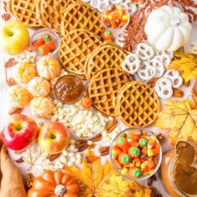 Waffles and other items on a brunch board.