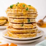 Stack of savory sweet potato pancakes with cheddar.