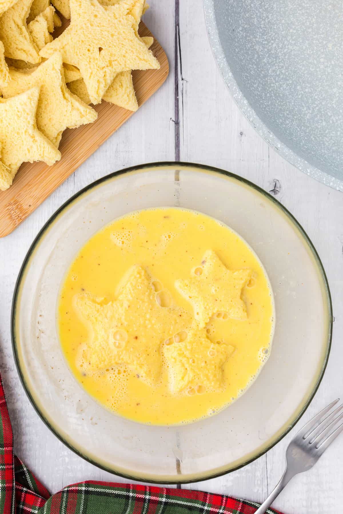 Star shaped bread dipped into egg mixture.