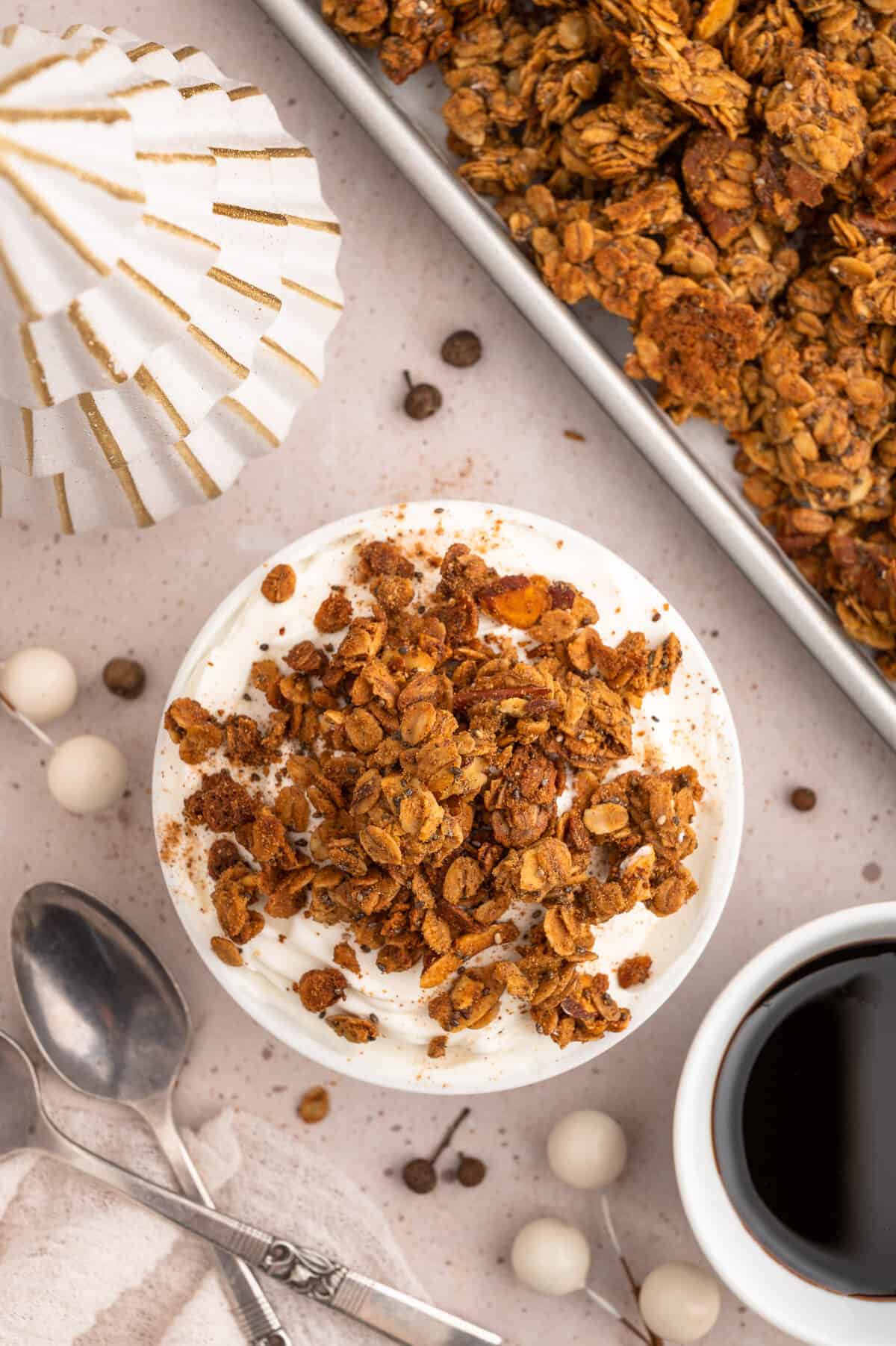 Granola on top of yogurt in a bowl.