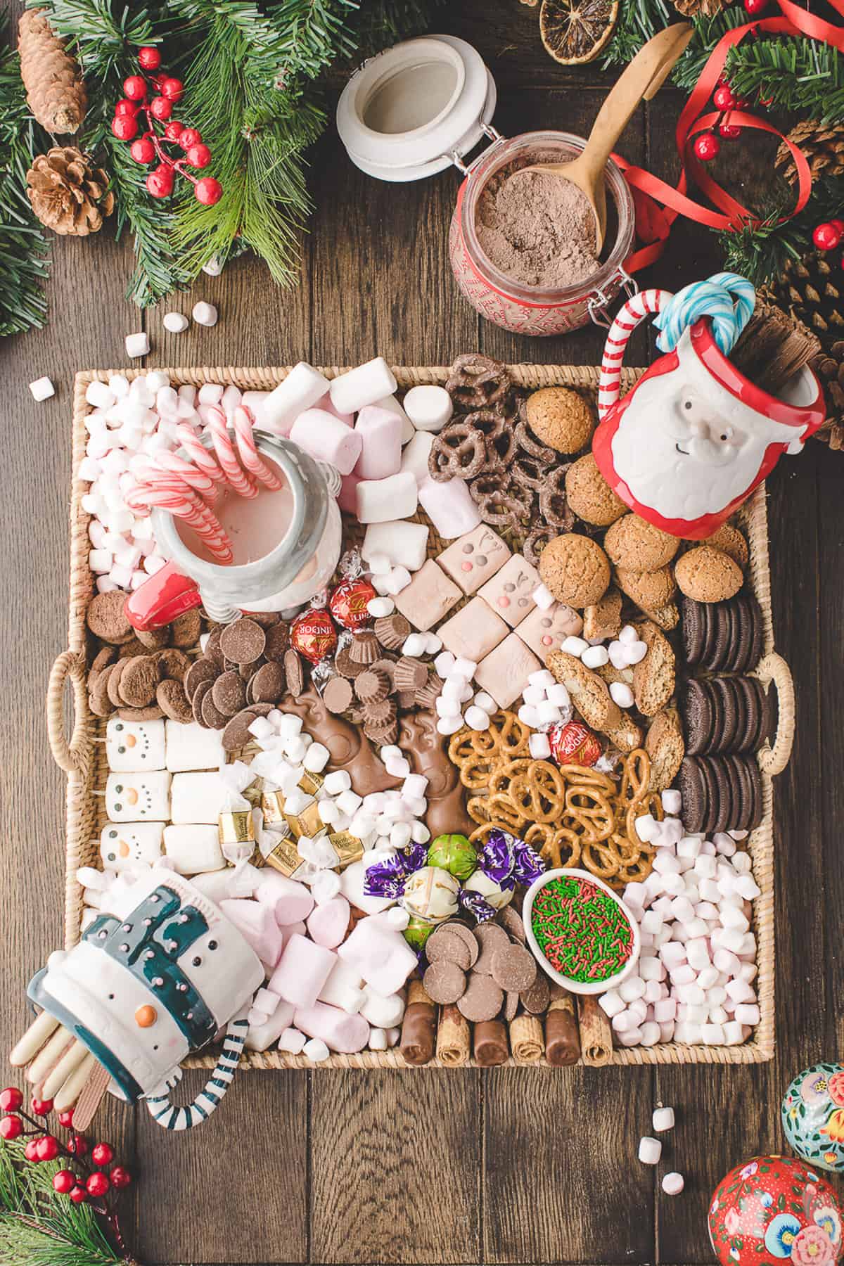 Hot cocoa charcuterie board with lots of toppings.