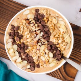 Peanut butter banana smoothie bowl with toppings.