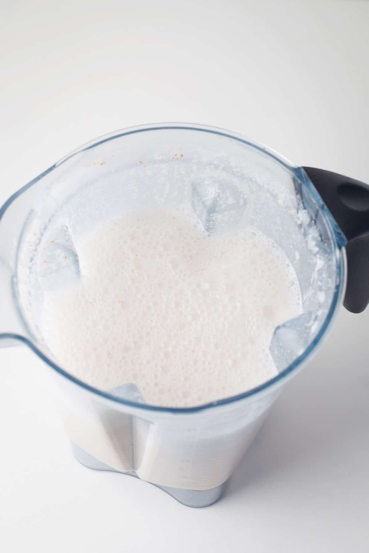 Almond milk in a blender.