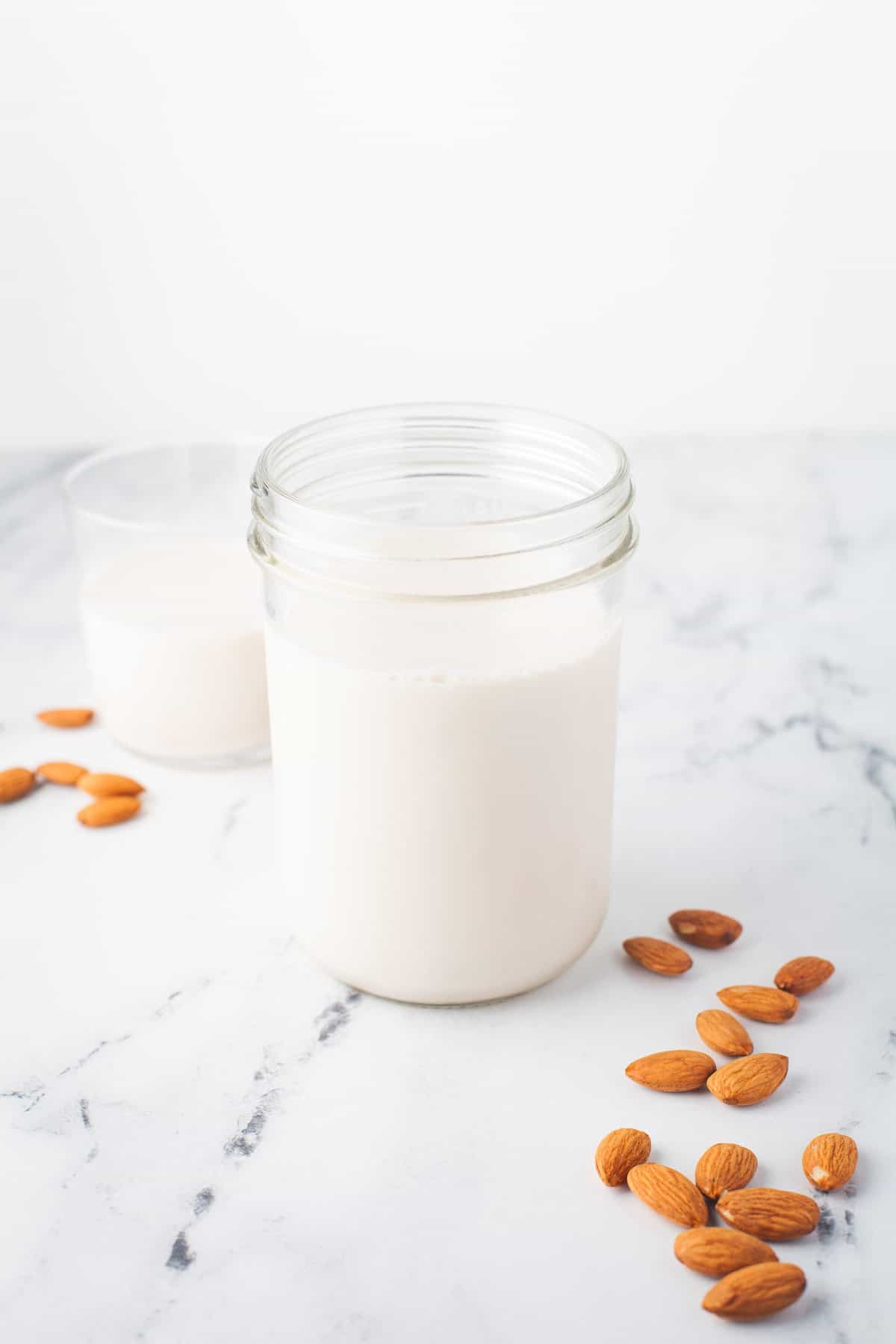 Almond milk in a clear jar.