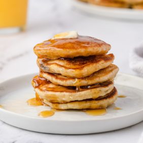 Banana silver dollar pancakes topped with butter and syrup.