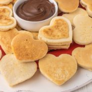 Mini heart pancakes with chocolate dip in the center.