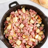 Corned beef hash in cast iron skillet.