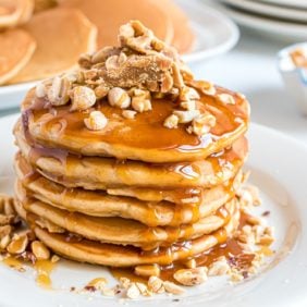Payday pancakes topped with peanuts and candy bars.
