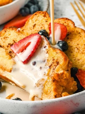Tres leches french toast casserole garnished with berries.