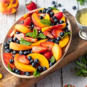 Summer fruit salad with poppy seed dressing.