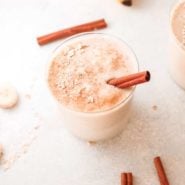 Banana smoothie with a cinnamon stick in it.